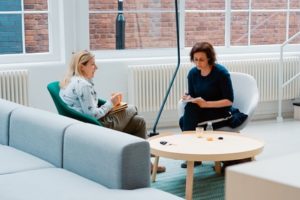 Two women conversing on couches in modern office | Wonderland Marketing & Sales | Strategy, Brand, Digital, Social & Data | High-Impact Campaigns that Scale | Global Expertise, Proven Results, Blue Chip Credentials | For Entrepreneurs, SMEs, Corporates | Cherryl Martin
