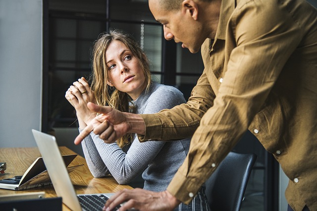 Man points to computer screen while female colleague looks on | Wonderland Marketing & Sales | Strategy, Brand, Digital, Social & Data | High-Impact Campaigns that Scale | Global Expertise, Proven Results, Blue Chip Credentials | For Entrepreneurs, SMEs, Corporates | Cherryl Martin